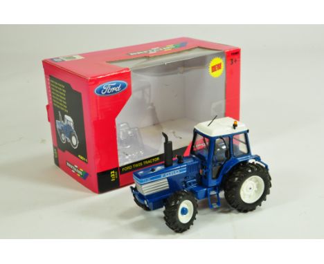 Britains Ford TW25 Tractor with extras applied. E in Box.