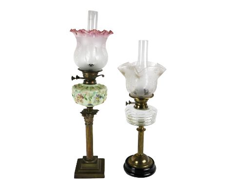 A brass Corinthian column Oil Lamp, with painted floral milk glass reservoir with shade and tube, together with another brass