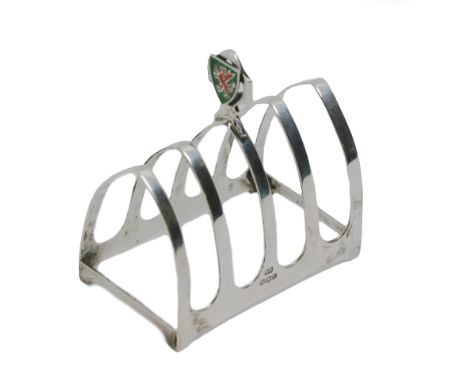 A silver five bar Toast Rack, by Sheffield c. 1936, with plain arch shaped bars, and a centre finger grip with an applied shi
