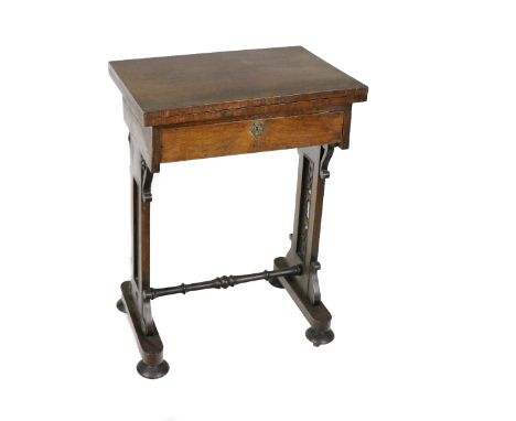 A Victorian Irish rosewood fold-over Card Table, with frieze drawer pierced decorated supports united by turned stretcher on 
