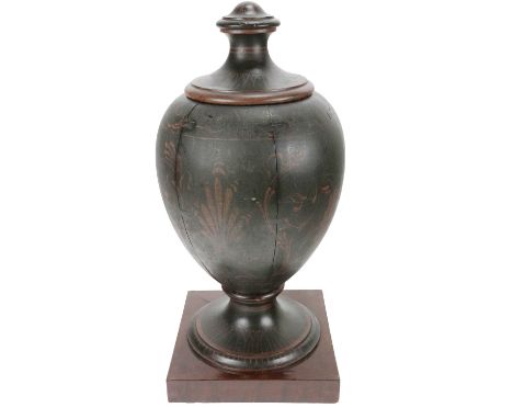 An 18th Century urn shaped Grecian design Tea Caddy, with lift top on a circular base mounted on a later plinth, 64cms (25") 