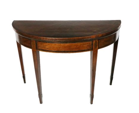 A 19th Century fold-over demi-lune mahogany Card Table, the segmented top with wide crossbanded border over a conforming frie