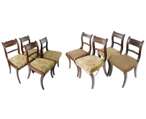 A set of 8 Harlequin mahogany Dining Chairs, each with shaped back railing (variant design) on front and back sabre legs, wit