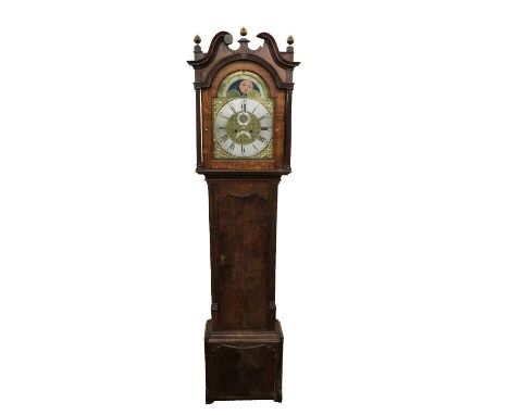 A 19th Century English oak cased Grandfather Clock, the swan neck pediment with brass finials over an ornate arched brass and