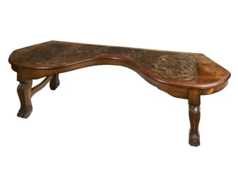 A late 19th Century / early 20th Century Celtic Revival carved Window Stool, (Limerick), the shaped top with central Celtic c