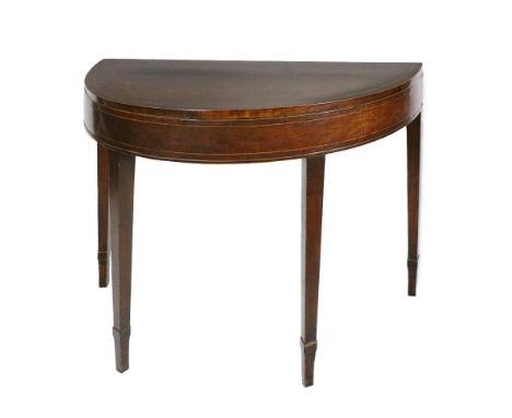 A Georgian mahogany and inlaid fold-over Card Table, the plain frieze on tapering satinwood inlaid&nbsp; mahogany banded legs