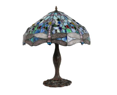 A large Tiffany style Dragonfly Table Lamp, the glass shade of blue and turquoise colour with multiple flying insects on a he
