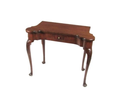 A fine quality Irish Georgian period mahogany fold-over Card Table, the shaped top opening to reveal baize centre and counter