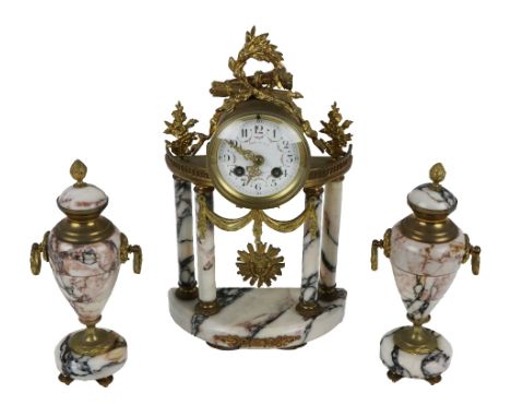 An attractive French ormolu and marble Clock Garniture, the pillar design clock with ormolu mounted garniture cornice, above 