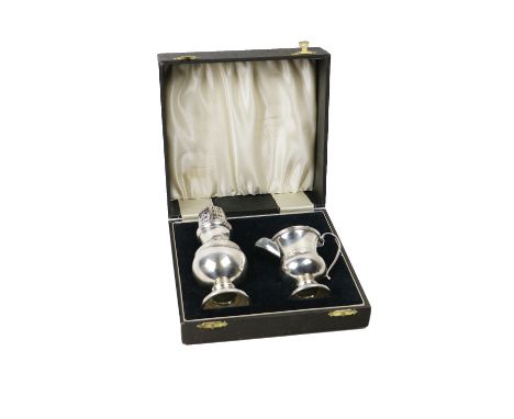 A cased silver Celtic design bulbous shaped Sugar Castor,&nbsp; and Cream Jug by S. Blanckensee &amp; Son Ltd., in original p