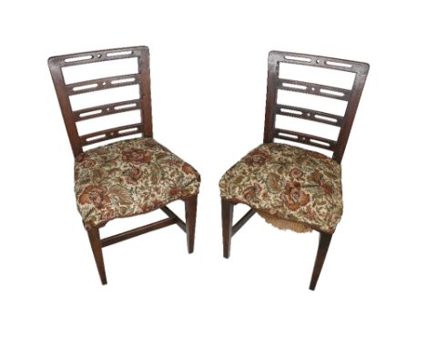 A set of 7 Georgian Provincial mahogany ladder back Dining Chairs, the pierced cross rail above upholstered seats jointed by 