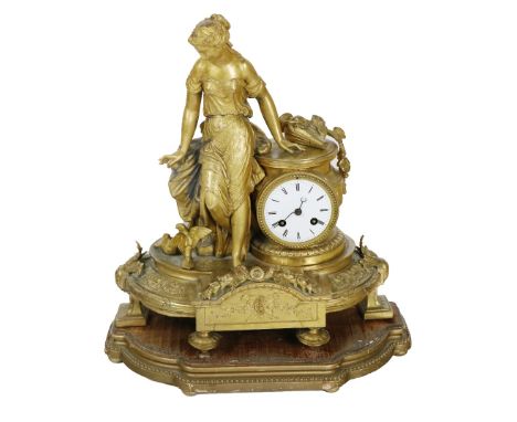 An attractive 19th Century French gilt Mantle Clock, depicting a young lady in low cut dress leaning against a pillar with in