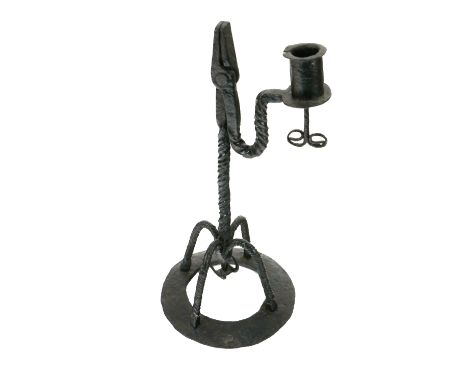 A good large late 18th Century wrought iron Rush Light, with twisted pillar supports, circular base and initials J.C., 41cms 