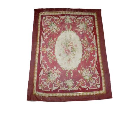 A 19th Century French Aubusson Tapestry, the centre with cream ground medallion with floral bouquet on a claret ground with c