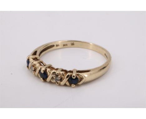 A sapphire and white stone ring, the small stones divided by saltire bars on a 9 ct gold shank, M, 1.4 g