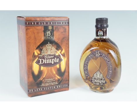 A boxed bottle of Dimple De Luxe Scotch whisky 