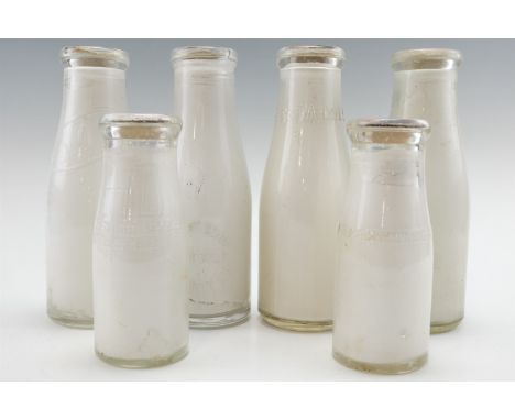 A quantity of vintage display milk bottles including "Horrells", "United Dairies" etc, 2nd quarter 20th Century, tallest 22 c