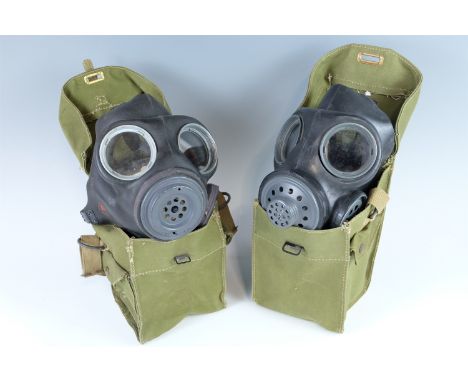 Two British army lightweight gas masks and haversack
