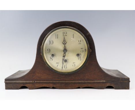 A 1940s oak "Napoleon hat" mantle clock, having a platform escapement and striking and chiming on gongs, (not running), 43 cm