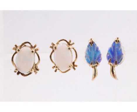 Two pairs of late 20th Century opal set yellow metal stud earrings, each respectively being an opal carved in the form of a l