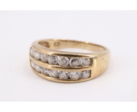 A contemporary 9 ct gold ring, channel-set with two parallel rows of seven cubic zirconia brilliants, between tapering should