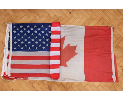 Three vintage cotton Canadian flags together with three USA flags, approximately 180 x 90 cm