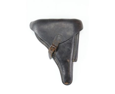 An Imperial German P'08 Luger pistol holster, dated 1915, together with a loading tool and magazine