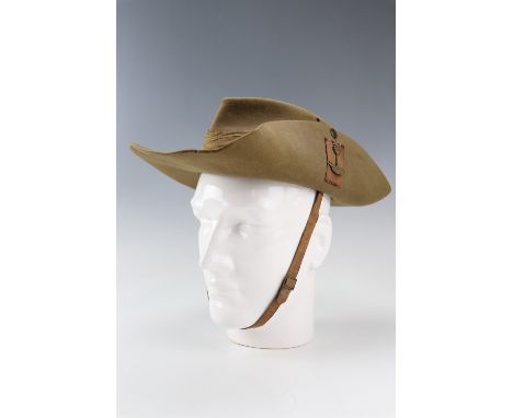 A 1942 British army bush hat bearing a cast brass Royal West African Frontier Force cap badge with maroon silk backing