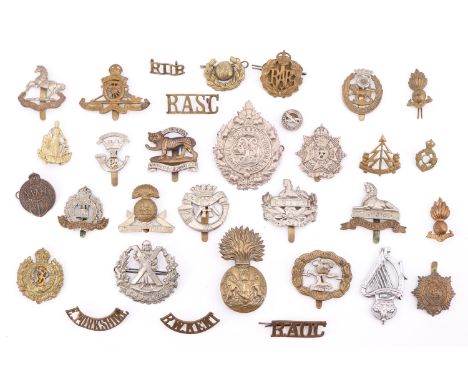A quantity of British army cap and other badges including NAAFI, Cape Corps and 18th (County of London) 'London Irish Rifles'