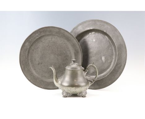 Two 19th Century pewter chargers together with a pewter teapot, largest charger 42.5 cm