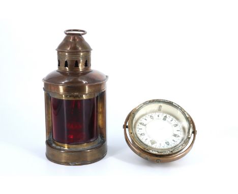 A demountable brass bulkhead 'port' light, having an oil burner, together with a brass boat's binnacle compass by Charles Bia