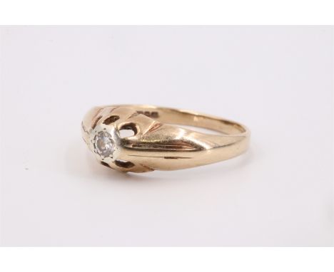 A 1970s diamond and 9 ct gold solitaire ring, having a 3.5 mm brilliant diamond flush set on a reeded open crown which merges