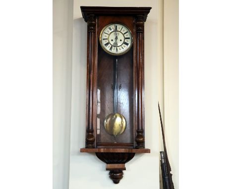 A late 19th / early 20th Century Vienna wall clock, having a two-train weight-driven movement and walnut case, 103 cm