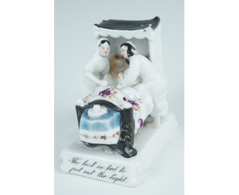 A Victorian ceramic fairing "The Last in Bed to put out the light", 7.5 cm, (a/f) 