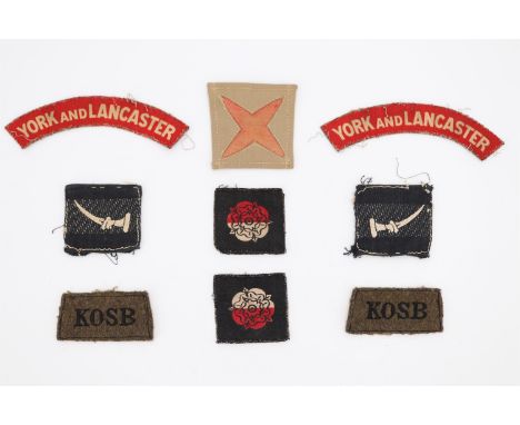 A small group of Second World War British army cloth insignia comprising a pair of York &amp; Lancaster Regiment printed shou