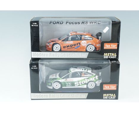 Two die-cast Modern Rally Collectables, Ford Focus WRC cars, 1:18 Scale