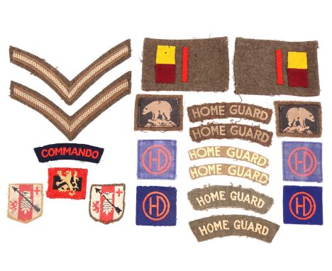 A small group of Second World War and later British army and Home Guard cloth insignia including 