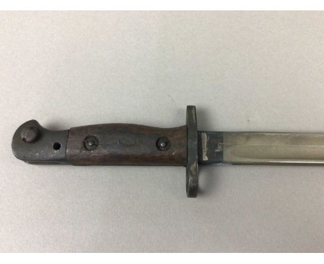 1907 PATTERN BAYONET BY WILKINSON,stamped marks including broad arrow to blade base, with scabbard, 58cm long