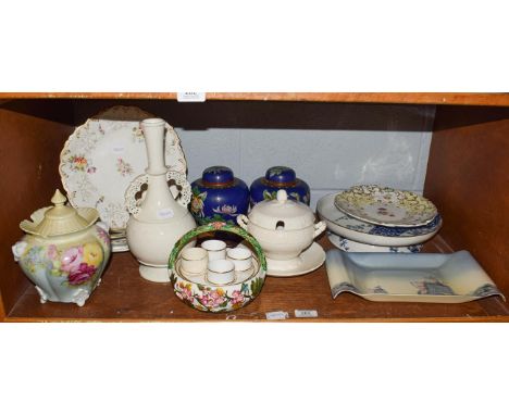 A shelf of decorative ceramics including a Coalport part service, Spode egg cup basket, pair of Chinese cloisonne vases and o