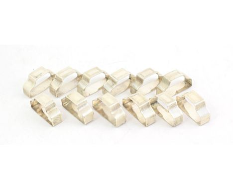 A Set of Twelve George VI Silver Napkin-Rings, by E. Silver and Co., London, 1945, each engine turned and with vacant cartouc