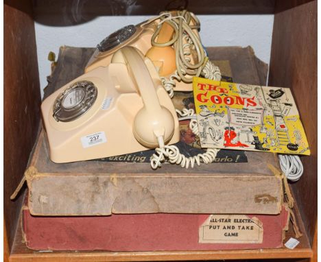 Two BT rotary dial cream Bakelite telephones together with a The Goons EP in picture sleeve, boxed Roular game and All Star P