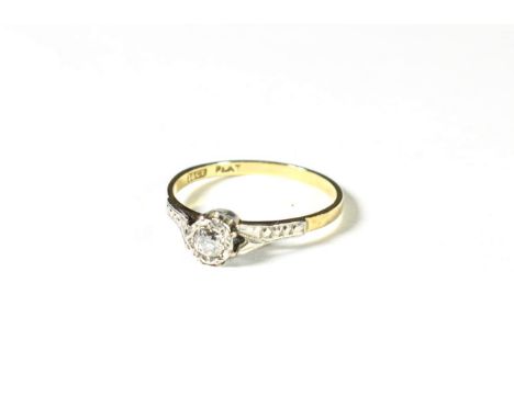 A diamond solitaire ring, the old cut diamond in a white rubbed over setting, to a textured shoulder plain polished shank, es