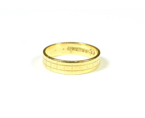 An 18 carat gold band ring, finger size P.  Gross weight 4.4 grams. 