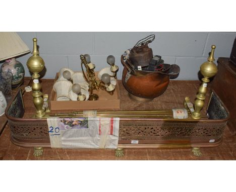 A quantity of mainly 19th century metalwares including a pierced brass fender, pair of fire dogs, fire tools, coal skuttle an