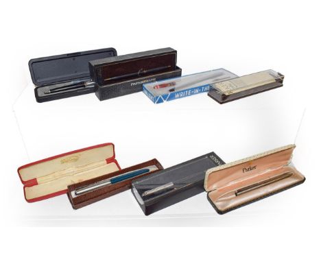 A cigar box containing pens, 19th century portrait miniature, commemorative crowns and another box of pens including fountain