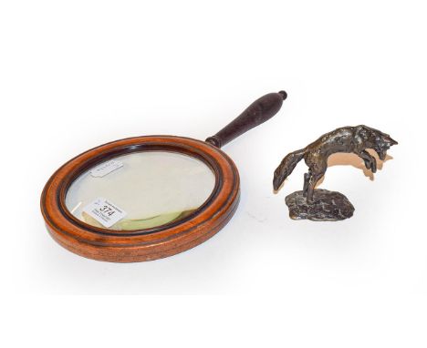 A small sculptured bronze model of a leaping fox, mid 20th century, monogrammed CC, 7cm, together with an oversized mahogany 
