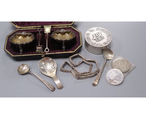 A cased pair of Victorian silver shell shaped salts and other items including a George III silver caddy spoon.