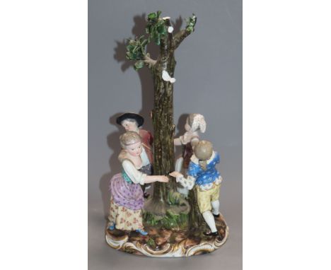 A 19th century Meissen centrepiece of children dancing around a tree incised model number 2628 height 29cm (a.f.)