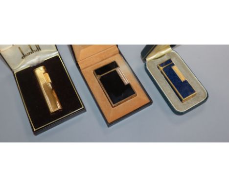 Two Dunhill lighters and a Dupont lighter, all cased