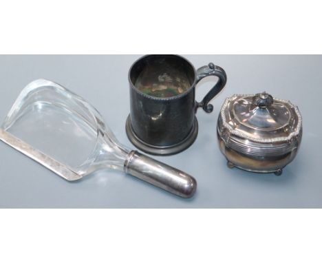 An unusual silver mounted glass crumb scoop, a Victorian silver tea caddy and a Victorian silver mug.